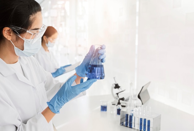 Free Photo asian woman working on a chemical project for a new discovery