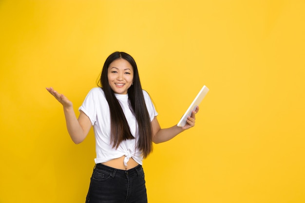 Asian woman on yellow, emotions