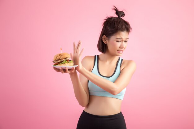 Asian women refuse fast food because of slimming on pink