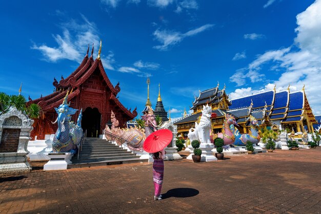 Asian women wearing Thai dress costume traditional according Thai culture at temple in Chiang Mai