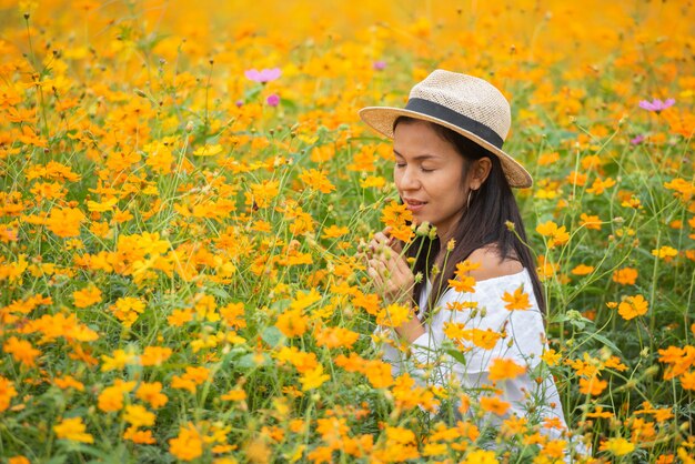 Asian women in yellow flower farm