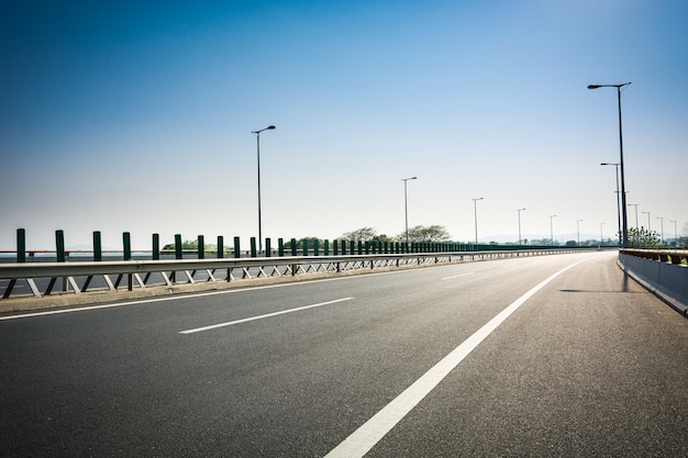 asphalt road and forest