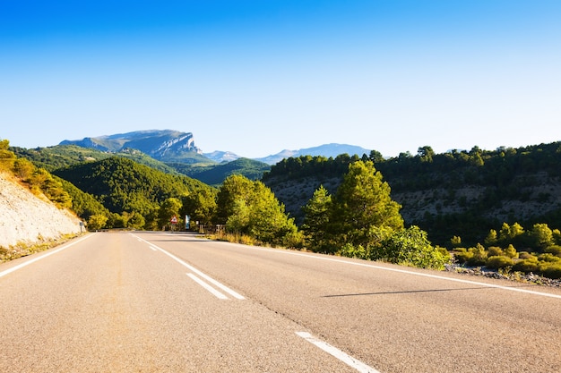 asphalt road through mountains