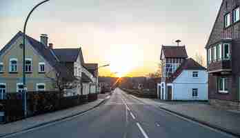 Free photo asphalt road in the town and sunset rural landscape