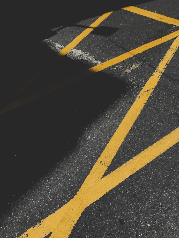 Free Photo asphalt with yellow traffic marking