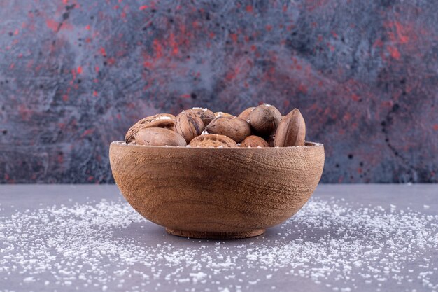 Assorted bowl of nuts on marble surface