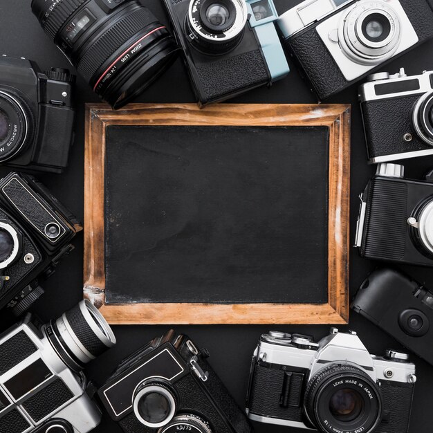 Assorted cameras around blackboard