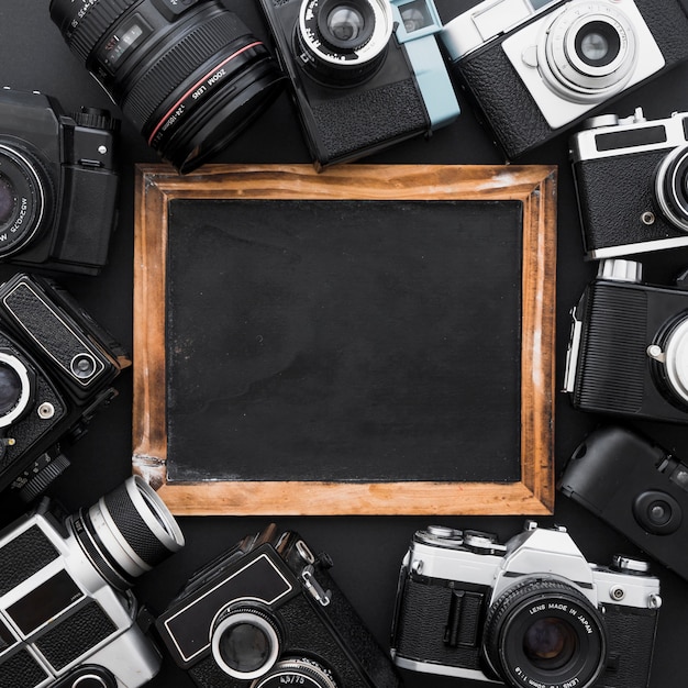 Assorted cameras around blackboard