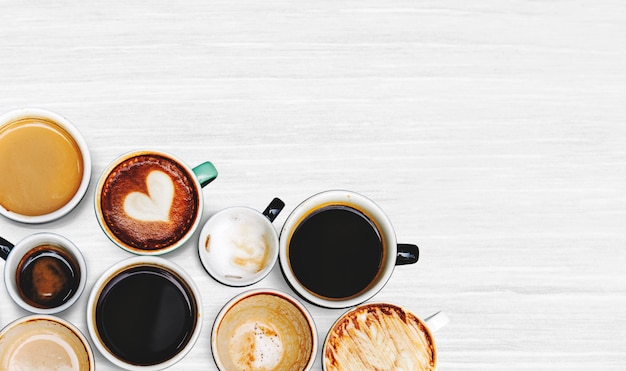 Free photo assorted coffee cups on a textured background