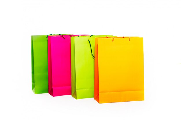 Assorted colored shopping bags including yellow, orange, pink and green