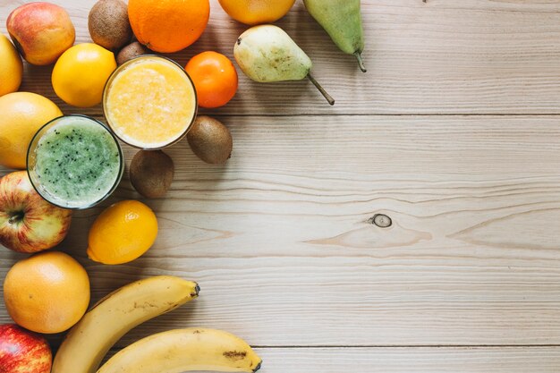 Assorted fruits near smoothies