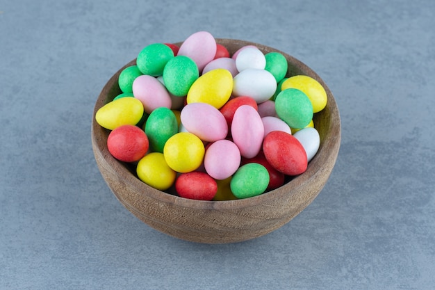 Assorted gum in the bowl, on the marble table. 