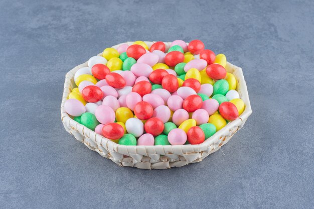 Assorted gums in the bowl on the marble background. 