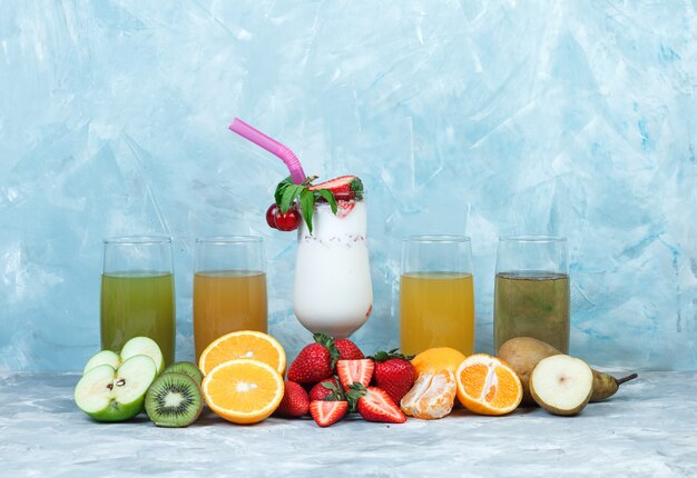 Assorted juices with milkshake and fruits