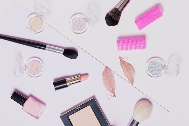 Free photo assorted makeup supplies on light background