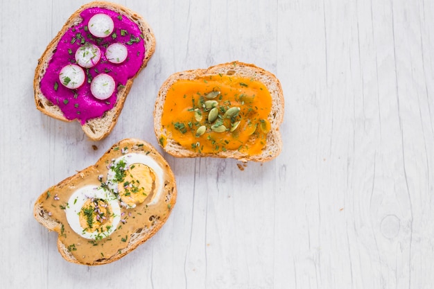 Assorted open sandwiches on white