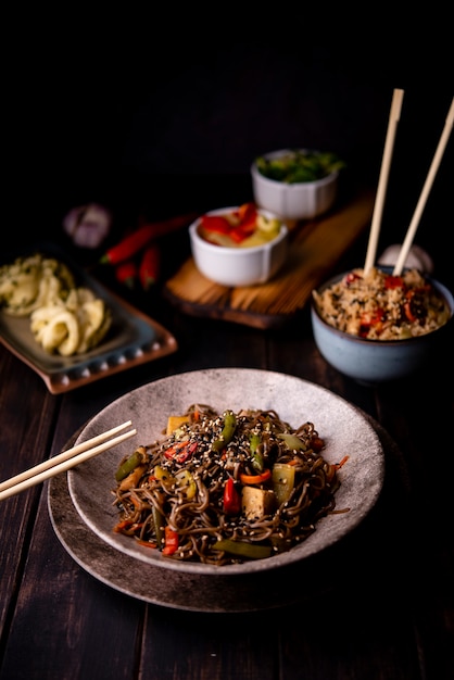 Assortment of asian food with bowl of noodles