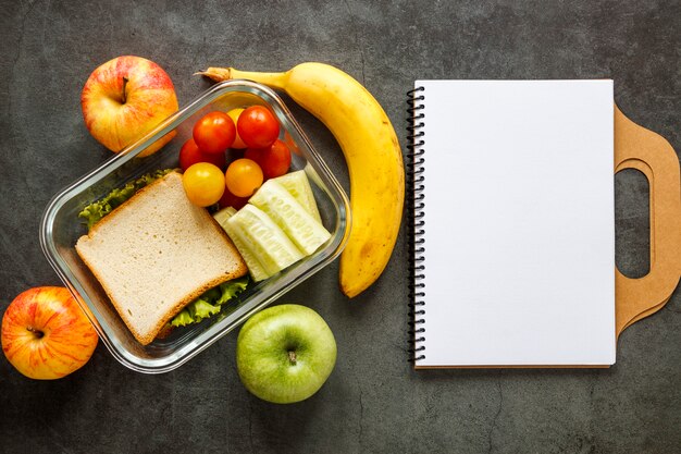 Assortment of batch food cooked with empty notebook