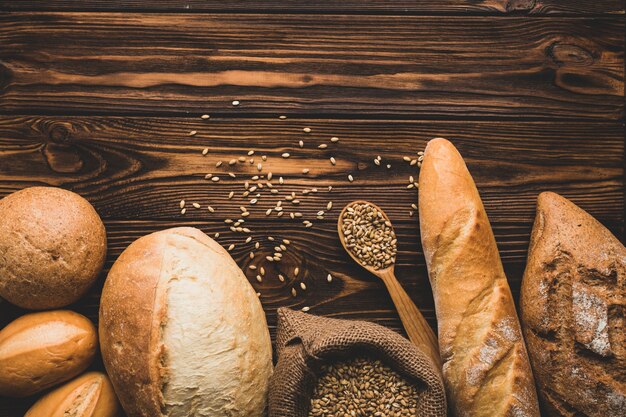 Assortment of bread loaves on wood