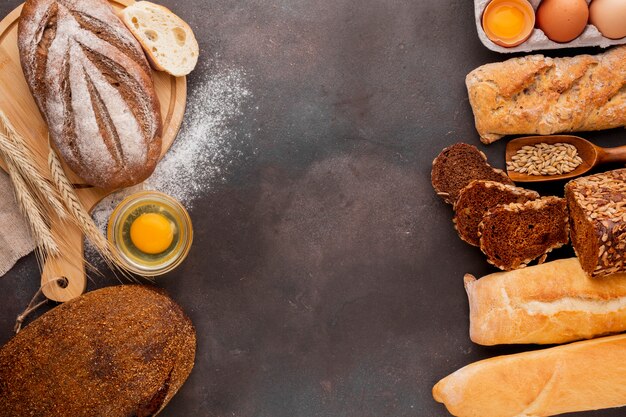 Assortment of bread with egg and textured background