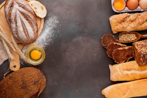 Assortment of bread with egg and textured background