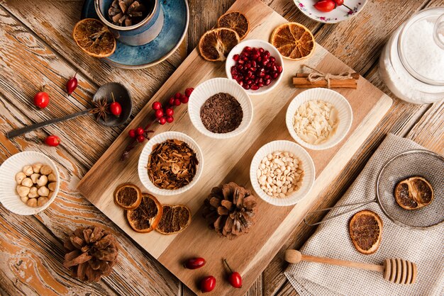 Assortment of cake topping ingredients on chopping board