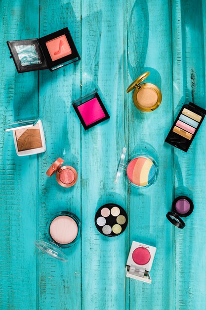 Assortment of cosmetics on wooden tabletop