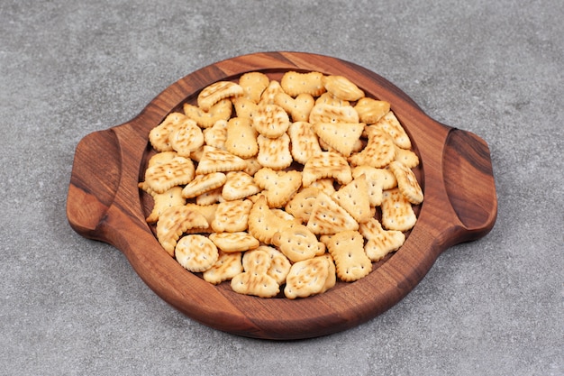 Assortment of delicious biscuits on wooden platek