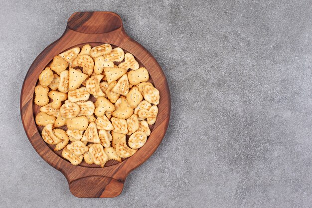 Assortment of delicious biscuits on wooden platek