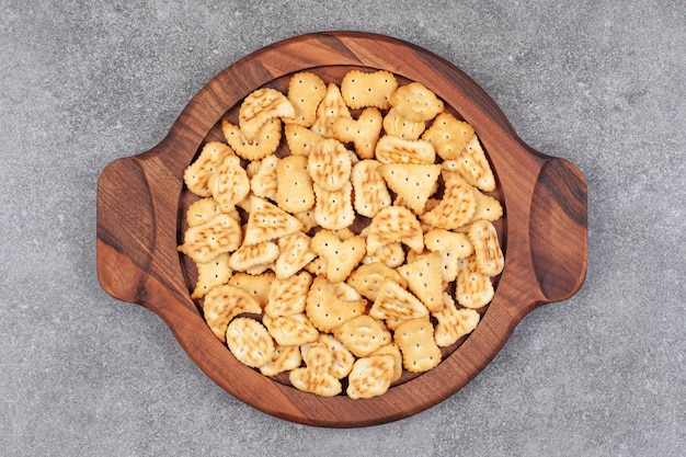 Assortment of delicious biscuits on wooden platek