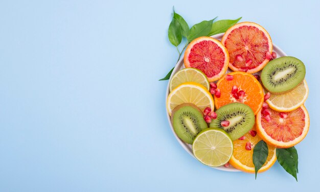 Assortment of delicious fruits with copy space