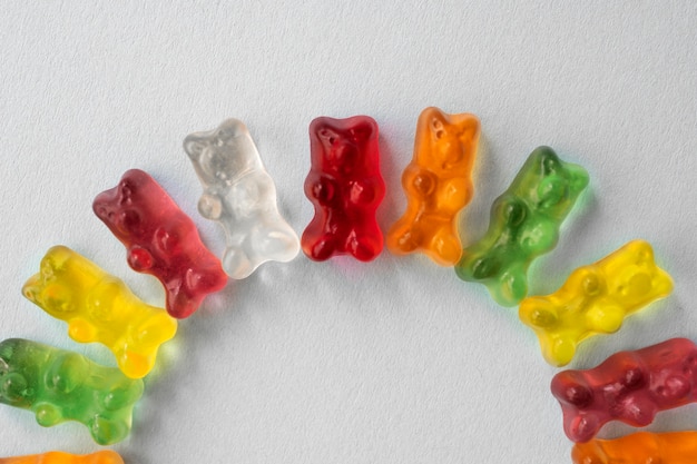 Assortment of delicious gummy bears in circle shape