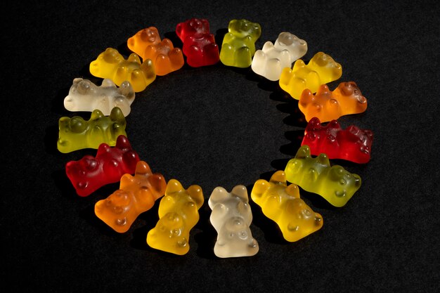 Assortment of delicious gummy bears in circle shape