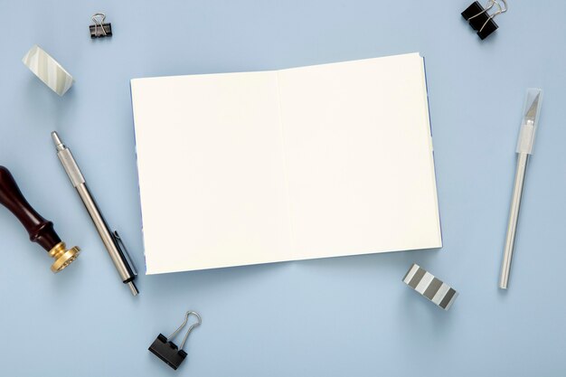 Assortment of desk elements with empty notebook