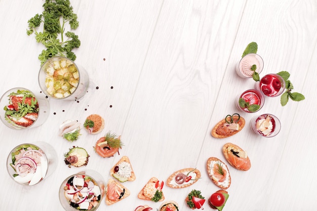 Assortment of different snacks, top view copyspace