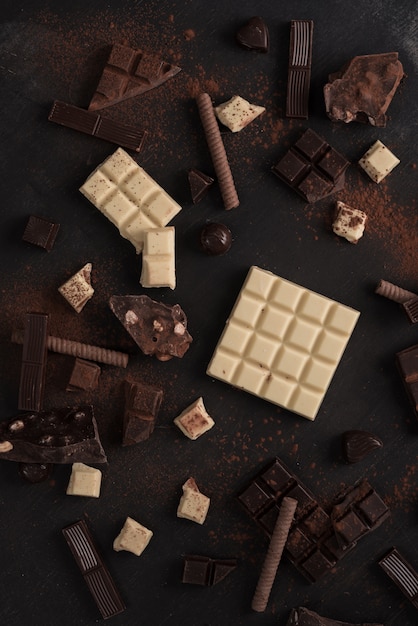 Assortment of different types of chocolate bars crashed into pieces