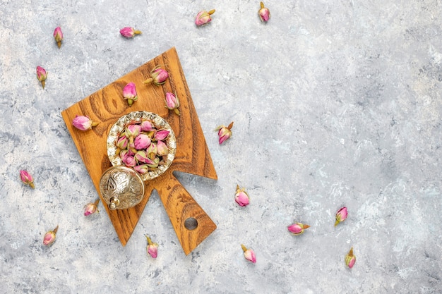 Assortment of dry tea in golden vintage mini plates. Tea types