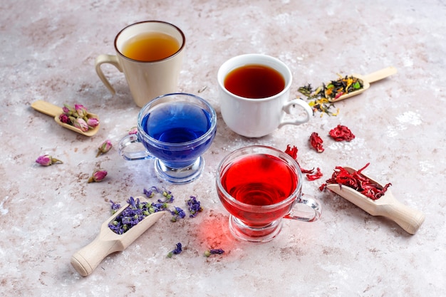 Assortment of dry tea in golden vintage mini plates. Tea types