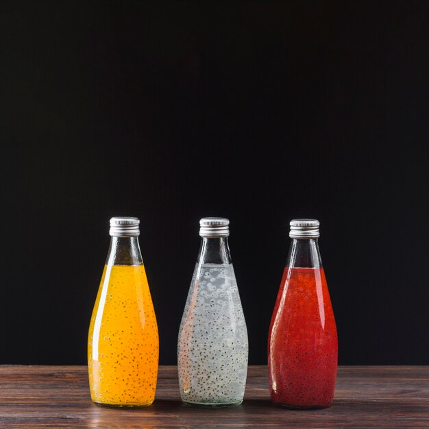 Assortment of fruit juices on black background