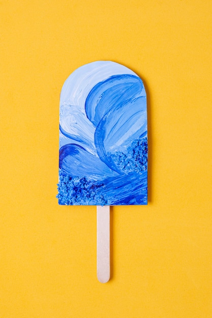 Assortment of fruit popsicles with ocean blue waves