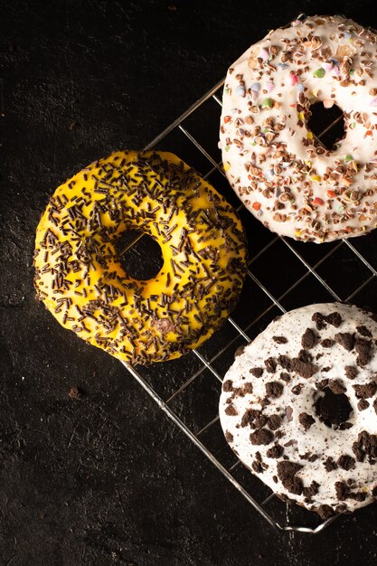 Assortment of glazed doughnuts with sprinkles