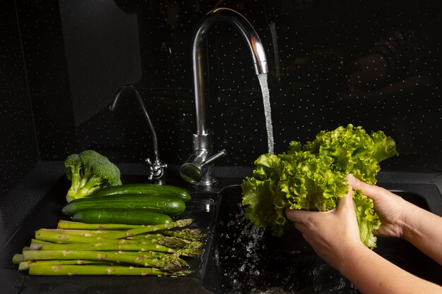 assortment of healthy food being washed