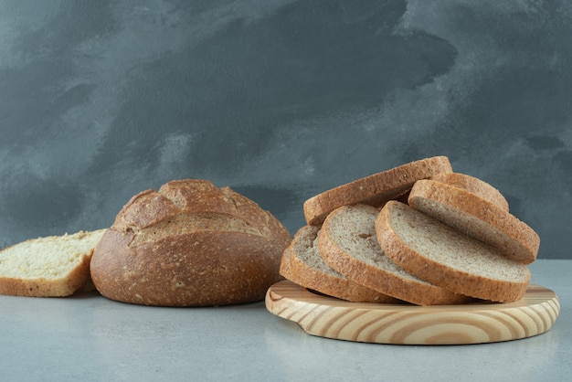 Assortment of homemade bread on stone table