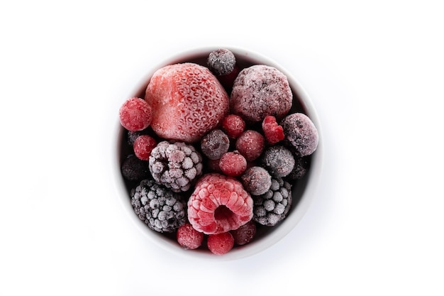 Assortment of iced berries in a bowl isolated on white background