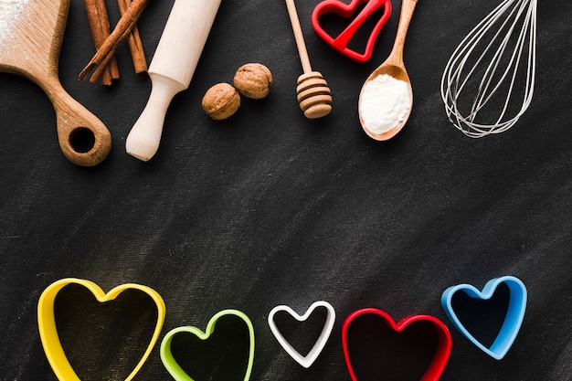 Assortment of kitchen utensils with colorful heart shapes