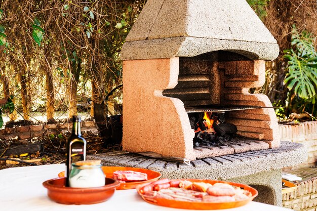 Assortment of meat near the outdoor barbecue