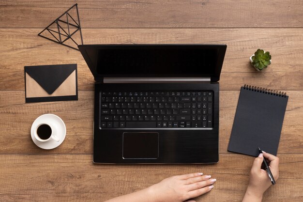 Assortment of office elements on wooden background