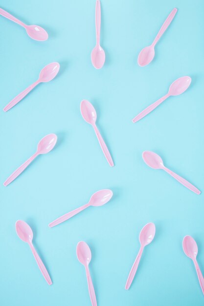 Assortment of pink plastic spoons