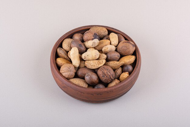 Assortment of shelled organic nuts placed on white background. High quality photo