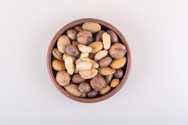 Assortment of shelled organic nuts placed on white background. High quality photo